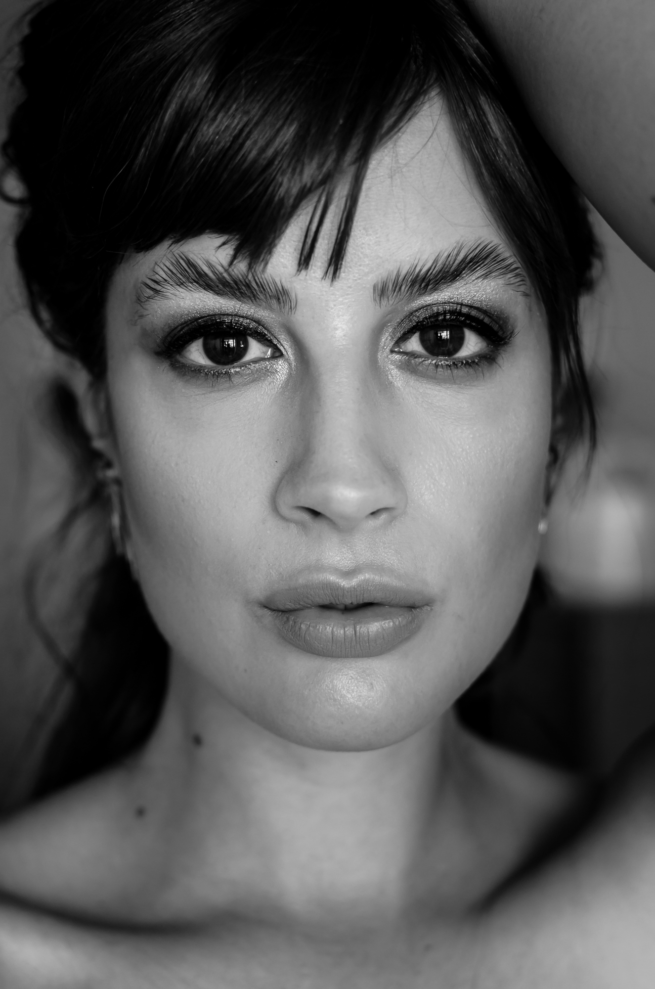 Close black-and-white portrait of Andrea Funk looking directly at the camera